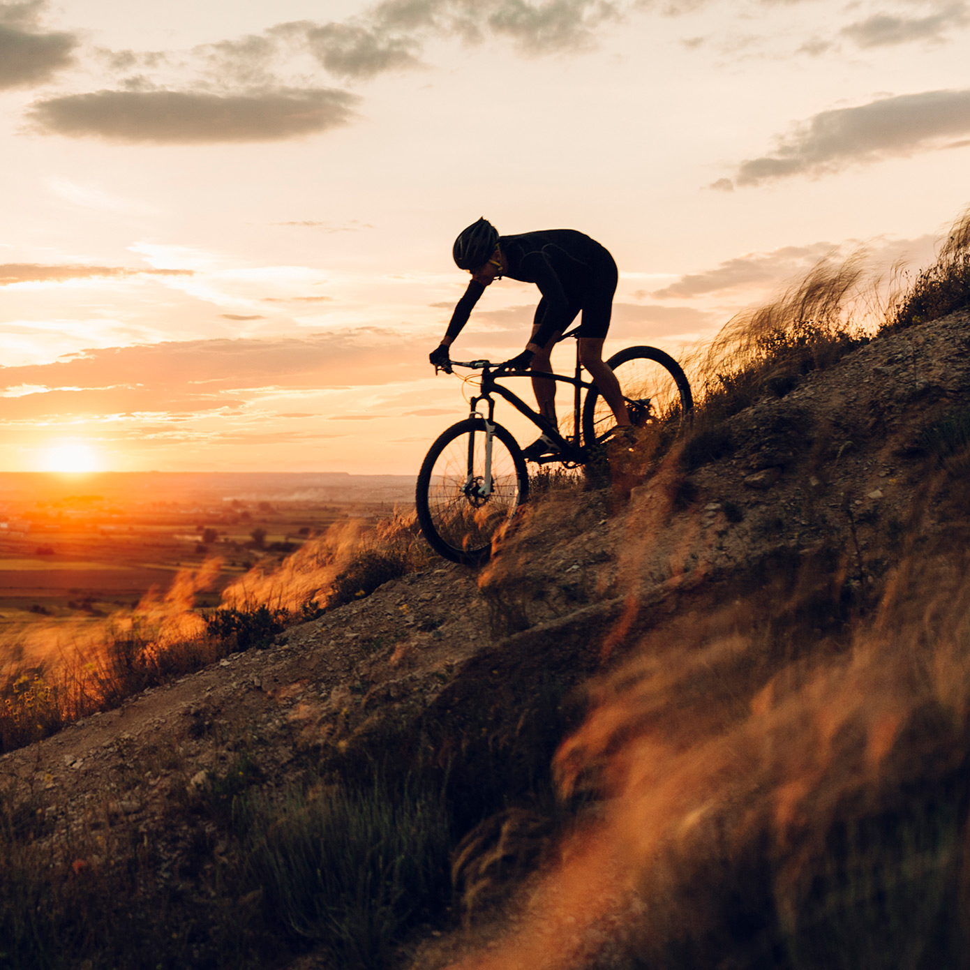 Man biking down mountain
