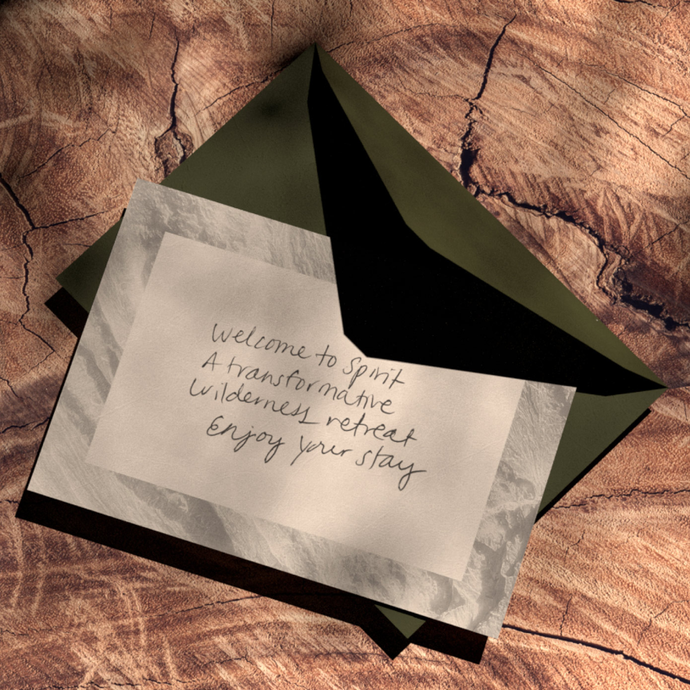 Notecard and envelope sitting on wood surface